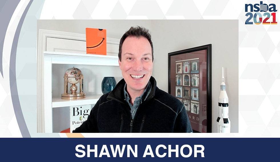 shawn achor smiles at the camera, the text "Shawn Achor"