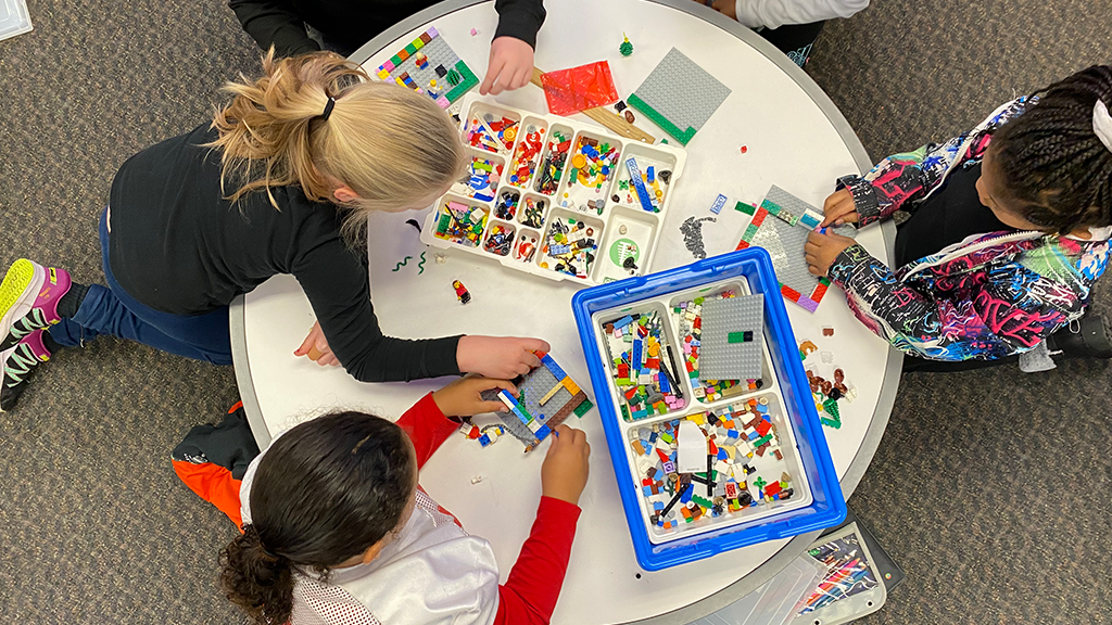 a overhead shot of children playing with building blocks 