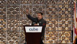 Speaker Cesar Cruz at the podium